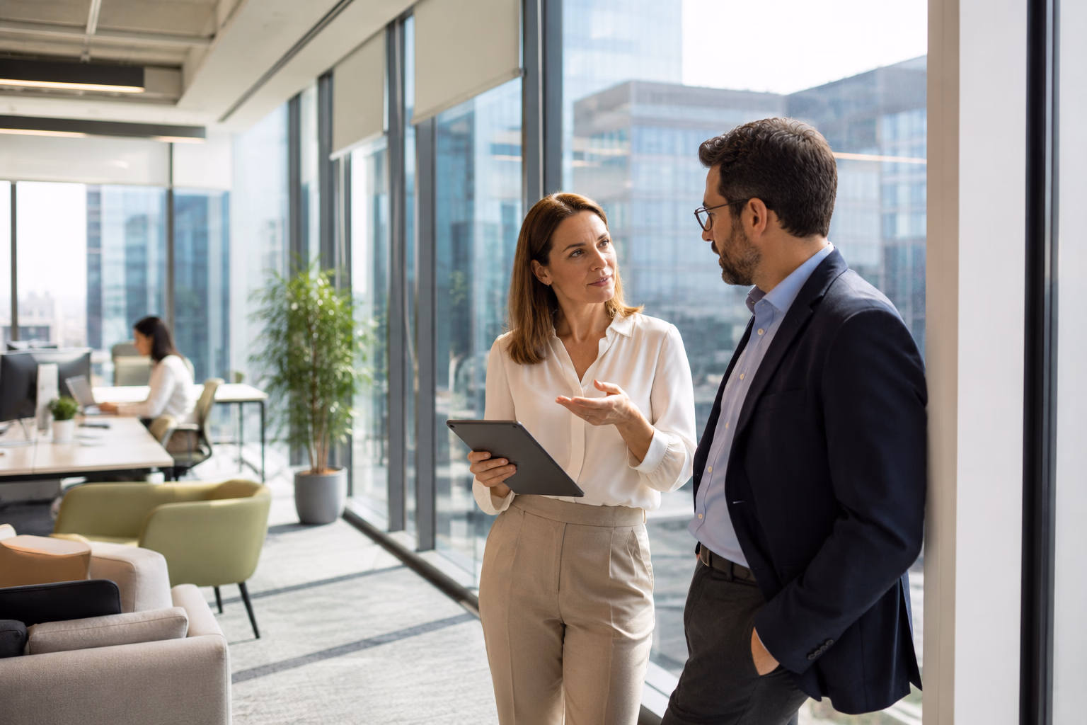 Commercial real estate advisors reviewing subleasing opportunities and lease restructuring options with corporate executives.